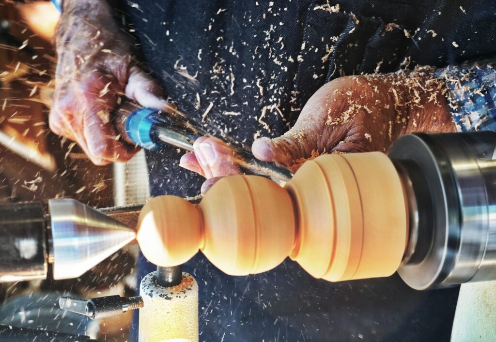 a man working on a machine in a factory